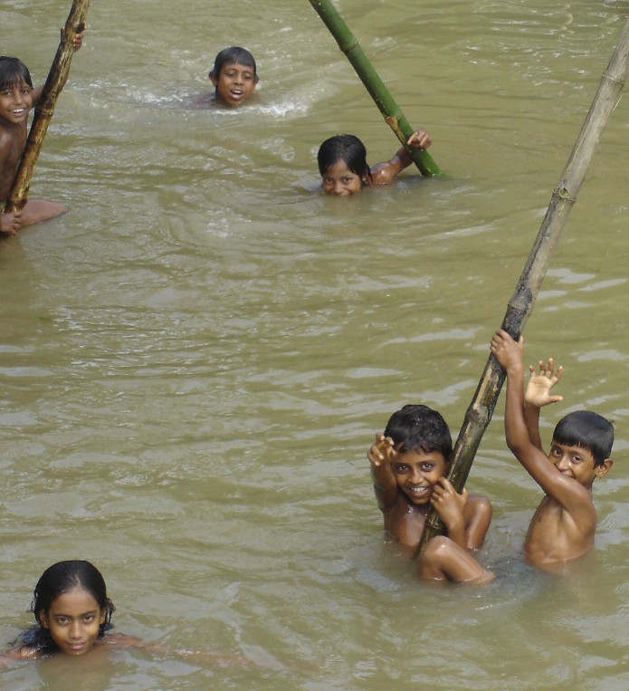 children in the monsoon water